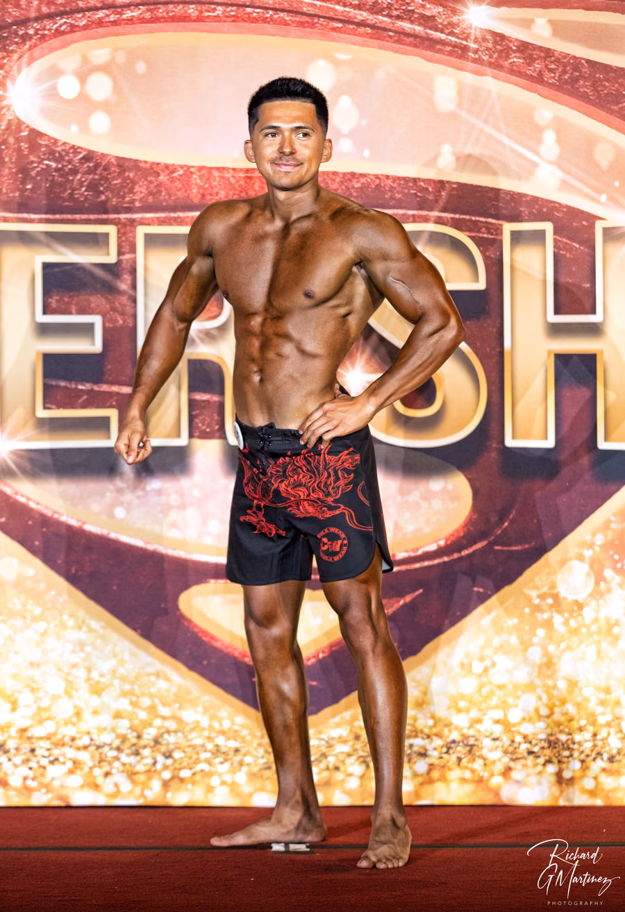 Mark Villanueva Jr. on stage at the NFF Super Show men's physique competition