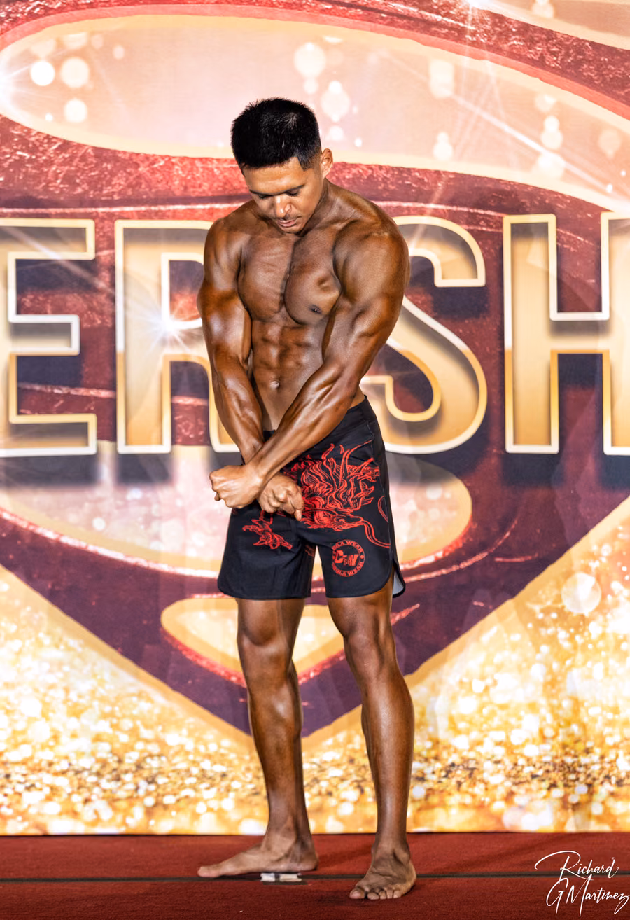 Mark Villanueva Jr. on stage at the NFF Super Show men's physique competition