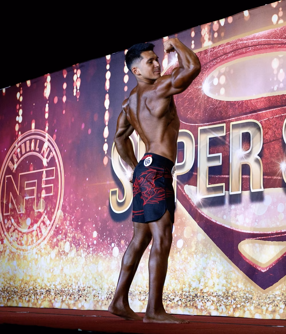 Mark Villanueva Jr. on stage at the NFF Super Show men's physique competition